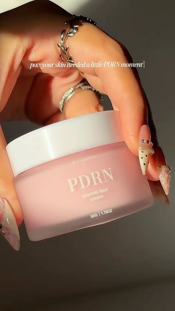 PURESKIN reel: PDRN peptide face cream held in hand